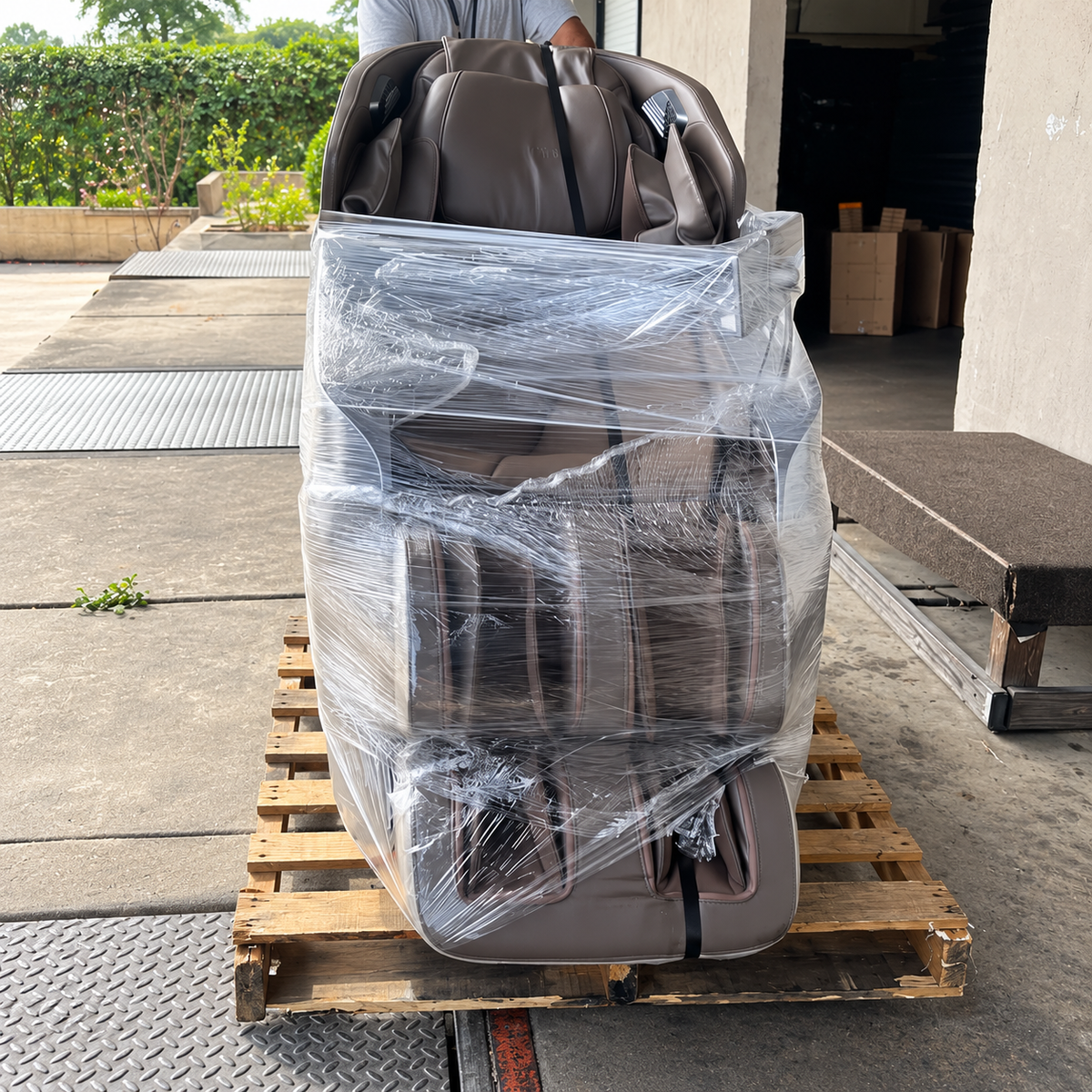 BOSSCARE SQ813 4D full body massage chair securely wrapped on a shipping pallet